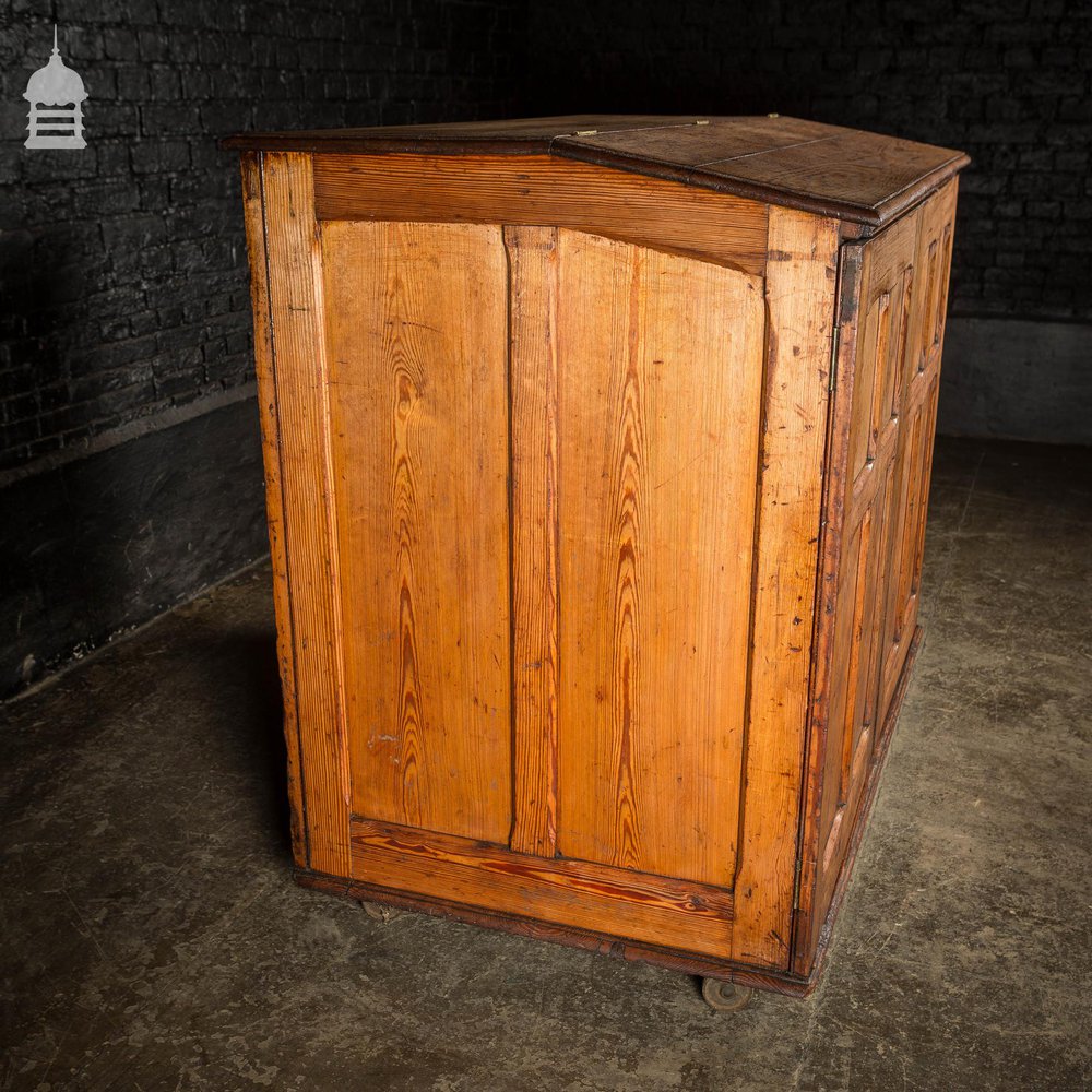 Large 19th C Figured Pitch Pine Ecclesiastical Cupboard with Double Doors, Opening Top and Metal Castors