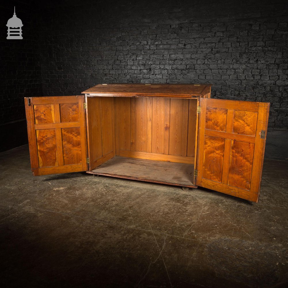 Large 19th C Figured Pitch Pine Ecclesiastical Cupboard with Double Doors, Opening Top and Metal Castors