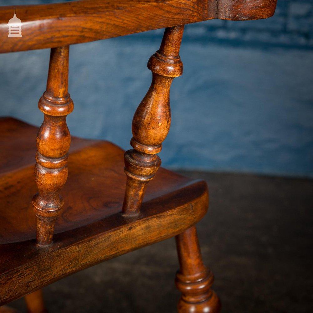 19th C Elm Captain’s Bow Seat Smokers Chair with Turned Arm Supports and Double H Stretcher