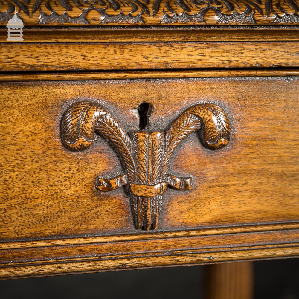 A Fine Late 19th C Sheraton Style Writing Table with Carved Prince of Wales Feathers Escutcheons and Elegant Mellon Fluted Legs.