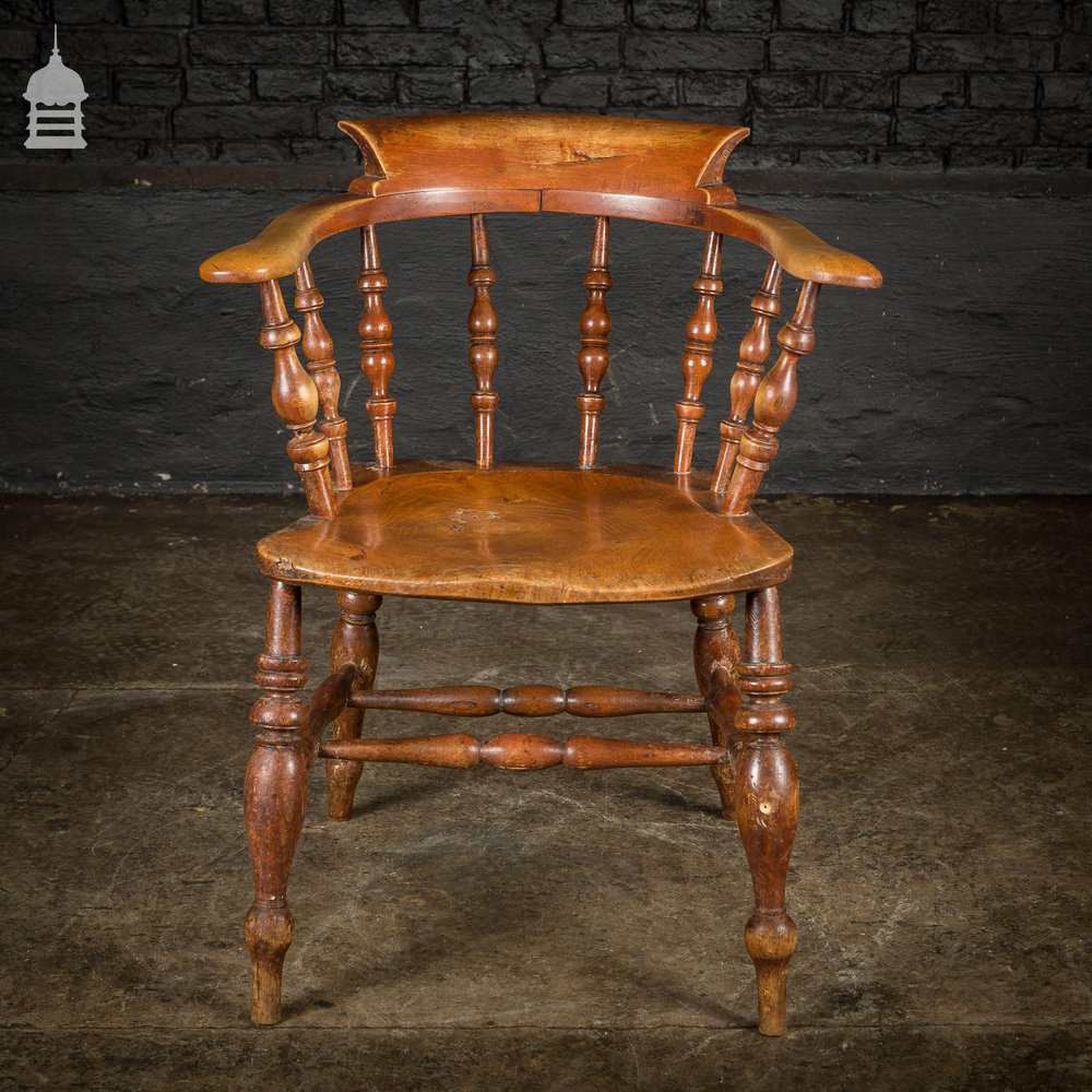 19th C Elm Captains Bow Seat Smokers Chair with Turned Arm Support and Double H Stretcher