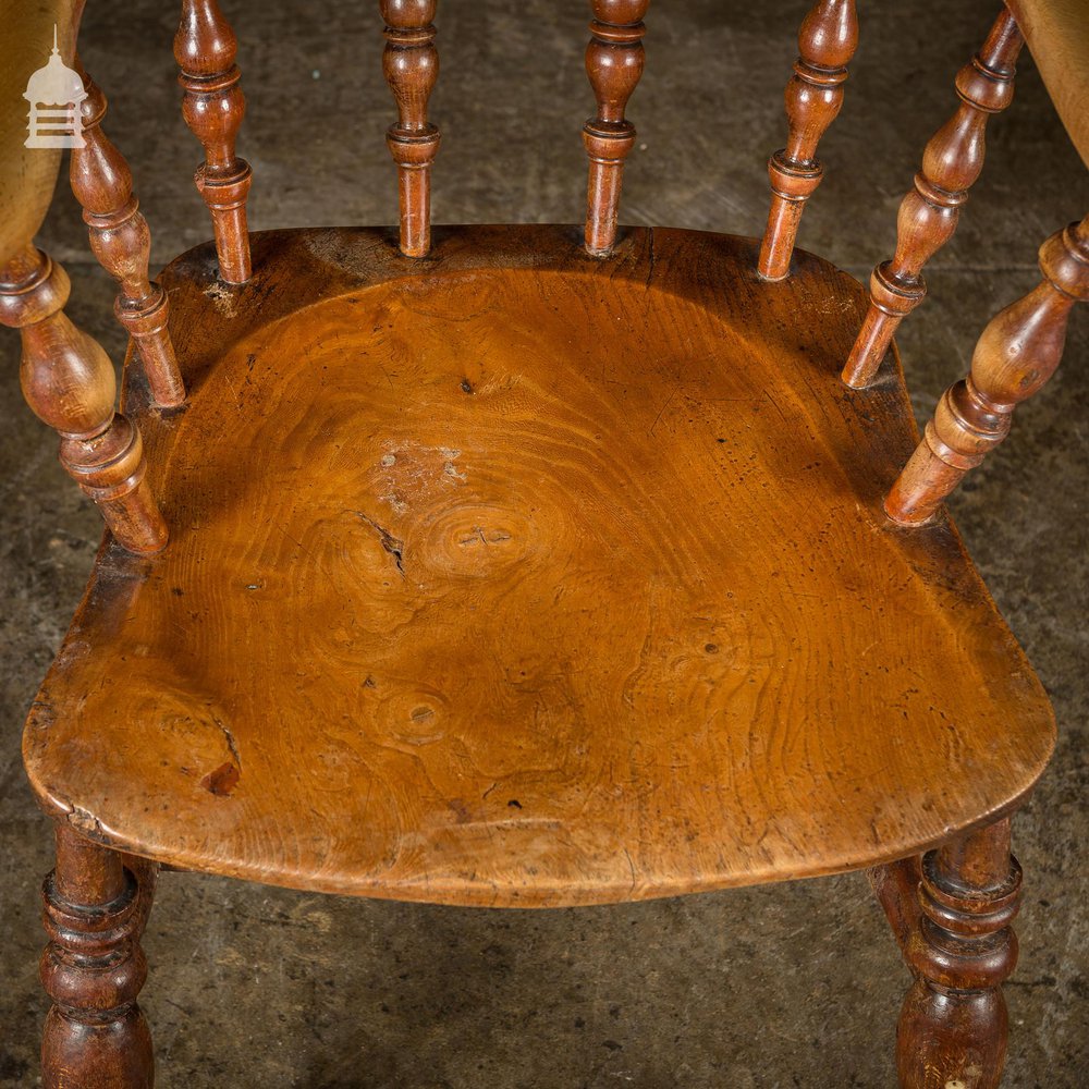 19th C Elm Captains Bow Seat Smokers Chair with Turned Arm Support and Double H Stretcher