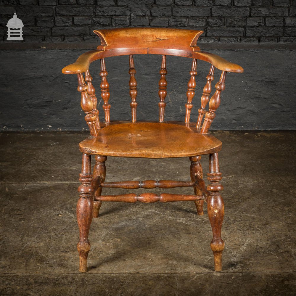 19th C Elm Captains Bow Seat Smokers Chair with Turned Arm Support and Double H Stretcher